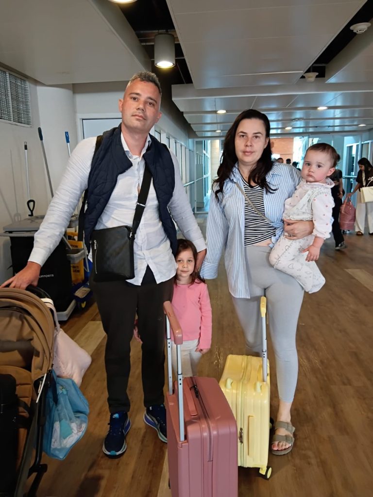 Family of guests arriving at Bali airport with luggage