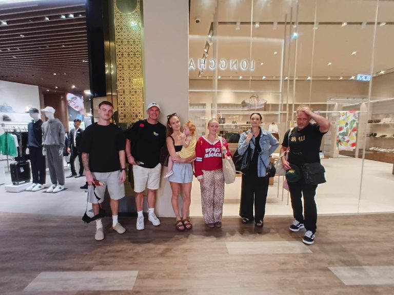 Group of guests with a Bali Meet and Greet agent inside the airport terminal